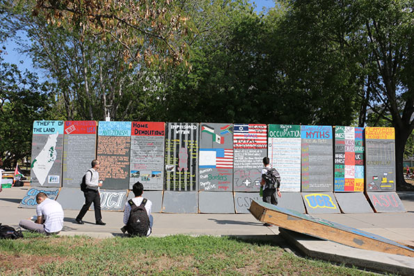 Source Credit: A replica wall built by Students for Justice in Palestine that helped spark dialogue on the tensions between Israel and Palestine. Paolena Comouche / Daily Titan (October 6, 2015)