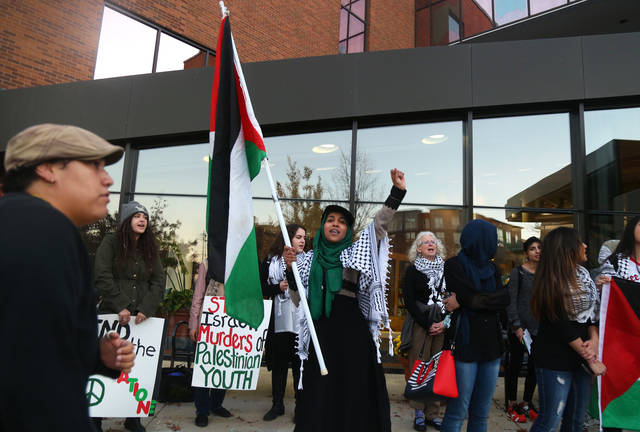 Source Credit: Sarah Awad stands with students and Minneapolis residents outside of Walter F Mondale Hall. The protest was organized by the Anti-War Committee regarding the U of M hosting Moshe Halbertal in his talk