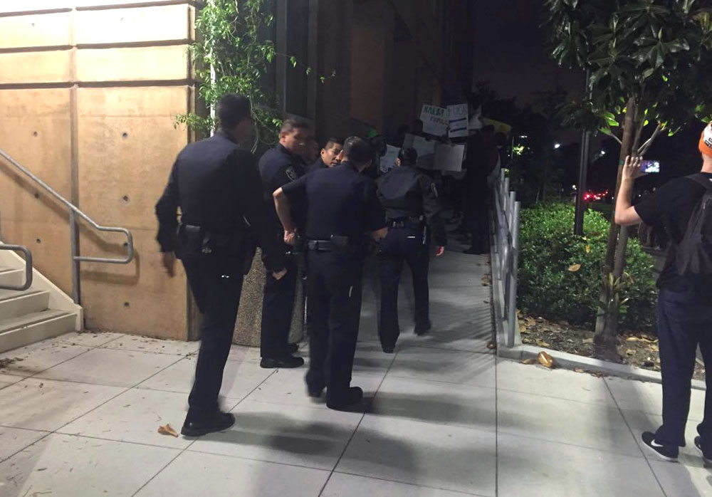 Police gather as students protest at UCI on Thursday night. Ariana Rowlands, Contributing Photographer